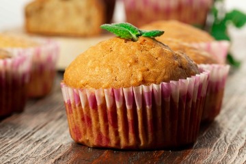Vanilla cupcake, homemade pastry on wooden background