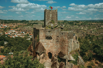 Obraz premium Stone castle and tower over rocky cliff
