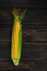 Corn on a dark wood background
