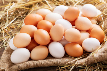 fresh eggs on wooden table