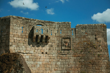 Balcony in gothic style on a wall made of stone