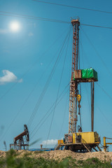 Drilling rig in oil field for drilled into subsurface in order to produced crude. Petroleum Industry. Toned.