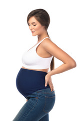 Young pregnant woman wearing maternity jeans