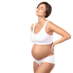 Fototapeta premium Pregnant woman has pain in her lower back or problems with kidneys