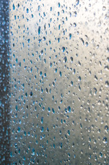 background of raindrops on window glass, close up