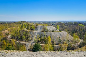 Coal industry in Poland. Mine heap in the spring scenery.