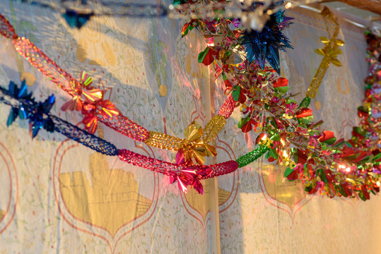 Colorful Sukkah Decoration Shiny Garland At Sunset Light.