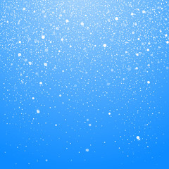 Naklejka na ściany i meble Snowfall isolated on blue background. Winter Christmas Background with Blue Sky. Falling Christmas Shining Beautiful Snow. Vector illustration