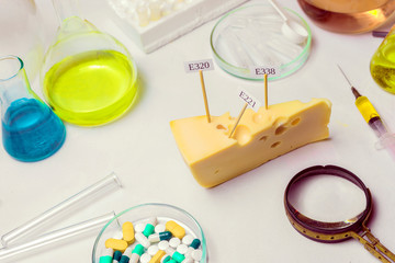 In the cheese are signs with the code E-supplements. Harmful food additives.