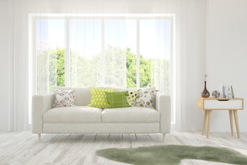 Stylish room in white color with sofa and summer landscape in window. Scandinavian interior design. 3D illustration