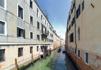 Fototapeta na wymiar Venetian canal in sunny day. Italy.