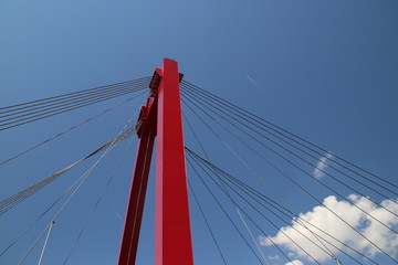 Red colored Willemsbrug over river Nieuwe Maas in Rotterdam, the Netherlands