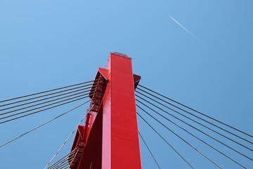 Obraz premium Red colored Willemsbrug over river Nieuwe Maas in Rotterdam, the Netherlands