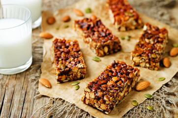 Honey nuts bars with glasses of milk