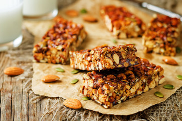 Honey nuts bars with glasses of milk