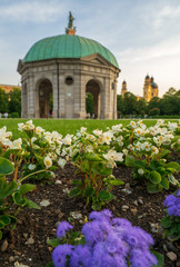 Chapel in Munich Hofgarden, summer evening sunset with flowers
