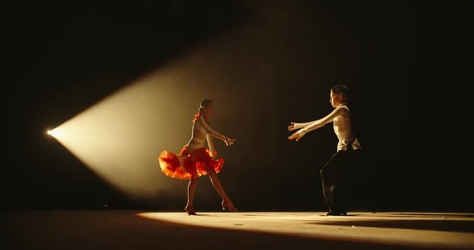 Talented asian kids showing ballroom dance on stage, on smoked black background - childhood dream, childhood memories concept 4k footage