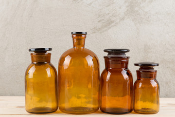 Retro pharmacy - vintage pharmacy bottles on wooden board