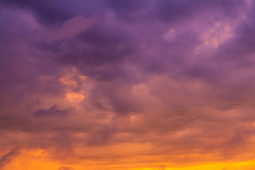 bright gradient clouds of orange and purple at sunset