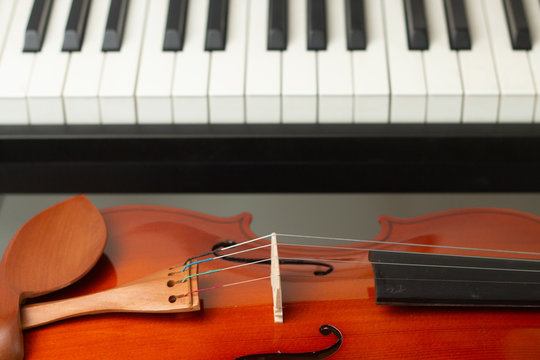 Electronic Piano Keyboard and Violin. Musical instruments.