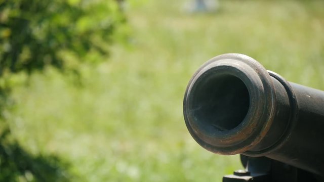 realistic cossak's cannon is being shot on the retro Ukrainian festival otdoors, Close up 