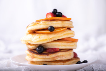 pancake stack with berries fruit - obrazy, fototapety, plakaty