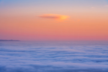 Fototapeta na wymiar Sunset above the clouds