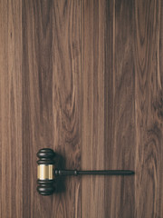 Wooden judge's gavel on wood background with copy space for mock up, 3D Rendering 