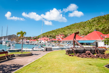 Gustavia, harbor landscape with red rooftop buildings. Saint Barthelemy, St Barts, St Barths.