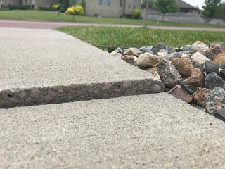 Frost heave crack in residential concrete sidewalk