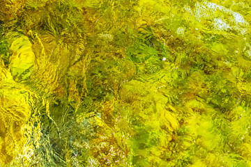 Clear water in colorful colors in abstract patterns