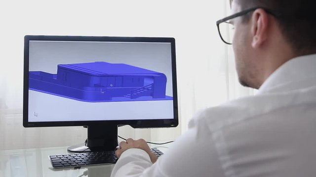 Engineer, Constructor, Designer, Architect in Glasses Working on a Personal Computer. He Creating New Design of Building Villa in CAD Program. Freelance Work