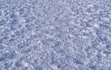 numerous footprints in the snow create a winter background