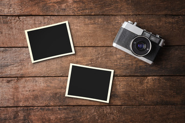 Vintage camera with empty photo frames. Top view
