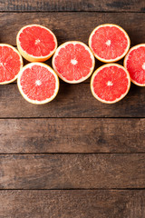 Fresh grapefruits on wooden background with copyspace