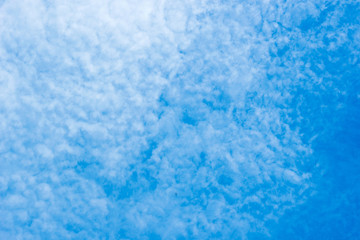 white cirrocumulus clouds on blue sky