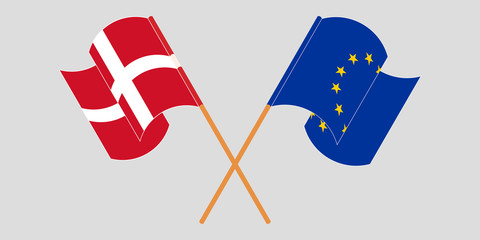 Crossed and waving flags of Germany and EU