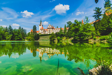 Fototapeta na wymiar Destination-Pruhonice town palace in Chech republic. Green nature and the lake