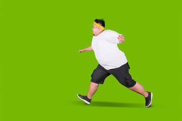 Scared fat man running away from something
