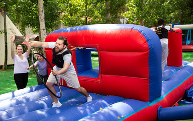 Bearded guy competing to collect hoops