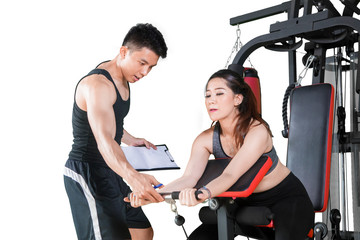 Fototapeta premium Trainer guiding his client to train on studio