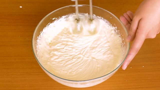 using a mixer, beat the curd with cream