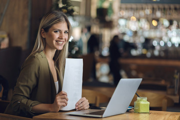 Fototapeta premium Happy businesswoman thinking of new business ideas and looking away.