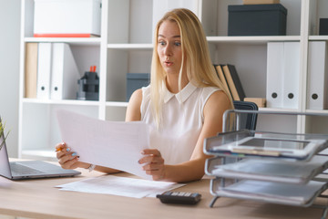 young beautiful woman work at office with documents sit at table study information