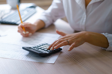 young pretty accountant make report to her boss calculate income and expenses