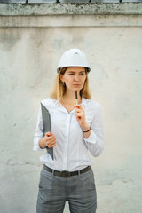 young beautiful woman work at building hold binder with documents