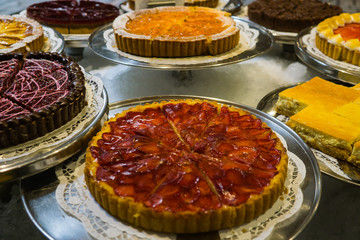 Restaurant desserts with strawberries, blueberries and other fillings.