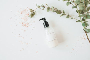 Healthcare spa concept with copy space liquid soap bottle on white background. Flat lay, top view...
