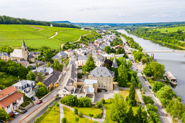 Fototapeta na wymiar Aerial view of Schengen town center over River Moselle, Luxembourg, the place where Schengen Agreement signed, the birthplace of a Europe without borders. Tripoint of borders with Germany and France