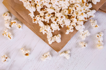 Obraz na płótnie Canvas Close up of popcorn on craft paper. Good movie viewing